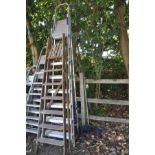 A SET OF ALUMINUM STEP LADDERS height 2.6m and a set of vintage wooden step ladders