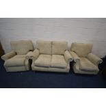 A CREAM UPHOSTERED THREE PIECE LOUNGE SUITE, comprising a two seat settee, armchair and a manual