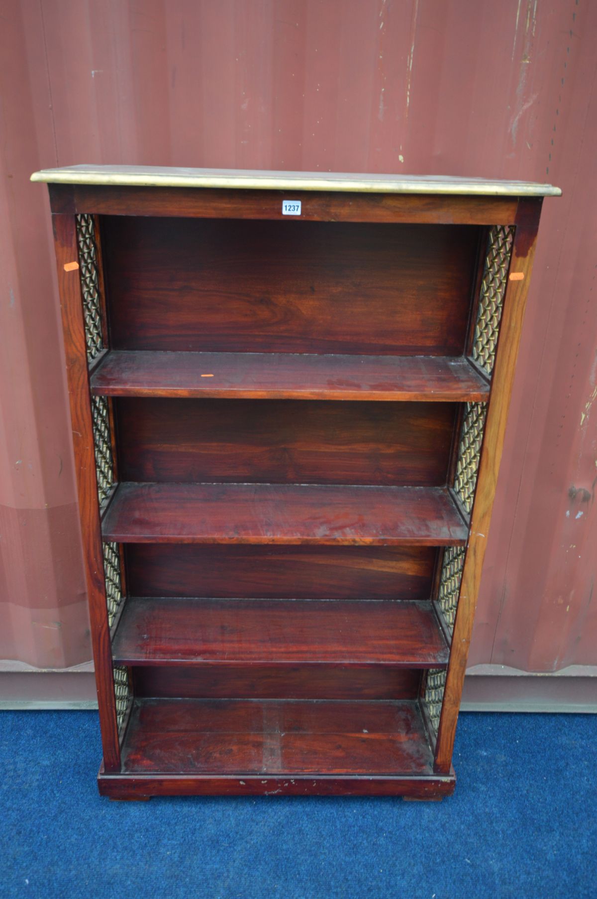 A HARDWOOD OPEN BOOKCASE with iron sides, width 90cm x depth 30cm x height 150cm (the item in this