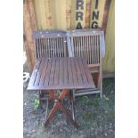 A HARDWOOD SET OF FOUR CHAIRS with a matching table 60cm squared x height 75cm (5)