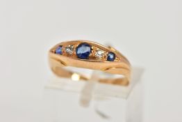 AN EARLY 20TH CENTURY, 18CT GOLD SAPPHIRE AND DIAMOND BOAT RING, set with three circular cut blue