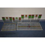 A SELECTION OF VARIOUS STAINED GLASS WINDOWS, to include a set of four windows, in two sizes, 48cm x