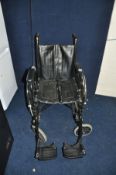 A WHEELTECH FOLDING WHEELCHAIR