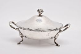 A SILVER AND GLASS CONDIMENT DISH, round form fitted with double handles, raised on three hoof feet,