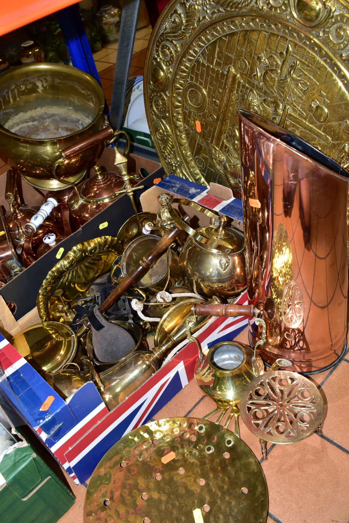 TWO BOXES AND LOOSE BRASS AND COPPER WARES to include coal scuttle, brass charger depicting a tavern