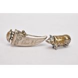 TWO BRASS VESTA CASES, the first in the form of a pig, the second of tapered 'tooth' shape with