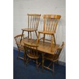 AN OAK EFFECT DROP LEAF KITCHEN TABLE,four spindle back chairs and five similar kitchen chairs (four