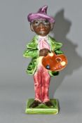A LATE 19TH CENTURY CONTINENTAL POTTERY FIGURE OF AN ARTIST HOLDING HIS PALETTE, with majolica style