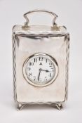 A 1920'S SILVER CASED CARRIGE CLOCK, of rectangular outline with wavy line border to the front, a