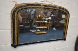 A NAPOLEON STYLE EBONISED AND GILT OVERMANTEL MIRROR, width 104cm x 69cm