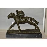 A BOXED REPRODUCTION BRONZE OF A HORSE AND JOCKEY, mounted on a marble style base, length overall