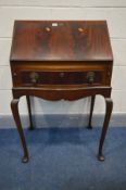 A MAHOGANY LADIES BUREAU, with a single drawer, on cabriole legs, width 67cm x depth 47cm x height