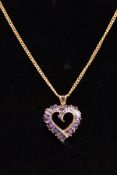A 9CT GOLD AMETHYST HEART PENDANT NECKLACE, the witches heart pendant set with tapered cut amethyst,