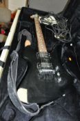 A BC RICH MOCKINGBIRD ELECTRIC GUITAR finished in black with two humbucking pickups, one piece