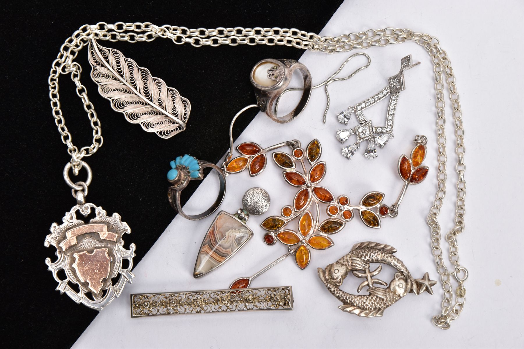 A SELECTION OF SILVER AND WHITE METAL JEWELLERY, to include a silver and rose gold detailed shield