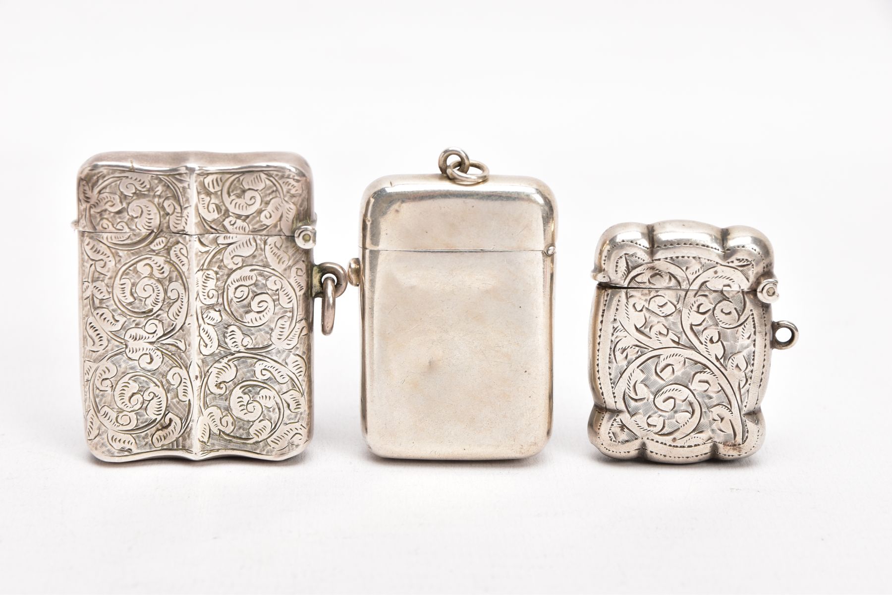 TWO LATE VICTORIAN SILVER VESTAS, AN EARLY 20TH CENTURY VESTA, AND A SMALL CERAMIC FIGURE, the first - Image 2 of 5