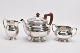 A 1930'S THREE PIECE SILVER TEA SERVICE, comprising a tea pot, milk jug and sugar bowl, each with