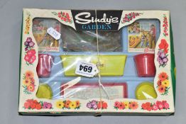 A BOXED TRI-ANG MAM'SELLE SINDY'S GARDEN SET, appears complete with two sealed packets of seeds,