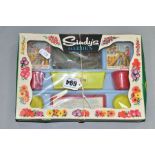 A BOXED TRI-ANG MAM'SELLE SINDY'S GARDEN SET, appears complete with two sealed packets of seeds,