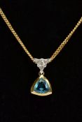 A 9CT GOLD GEM SET PENDANT NECKLACE, the pendant set with a triangular cut blue topaz, fitted with a