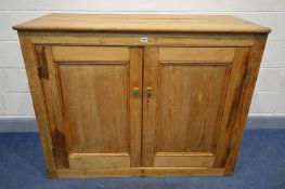 A VICTORIAN PINE PANELLED TWO DOOR CUPBOARD, width 134cm x depth 61cm x height 107cm