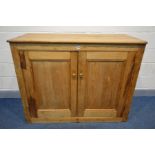 A VICTORIAN PINE PANELLED TWO DOOR CUPBOARD, width 134cm x depth 61cm x height 107cm