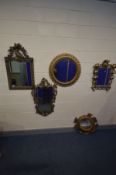 FOUR VARIOUS WALL MIRRORS, to include an ornate gilt circular mirror, a heavy open foliate mirror,