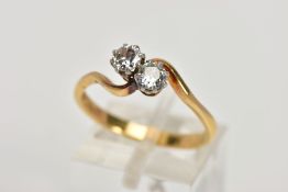 A MID TO LATE TWENTIETH CENTURY TWO STONE CROSSOVER DIAMOND RING. Two early round brilliant cut