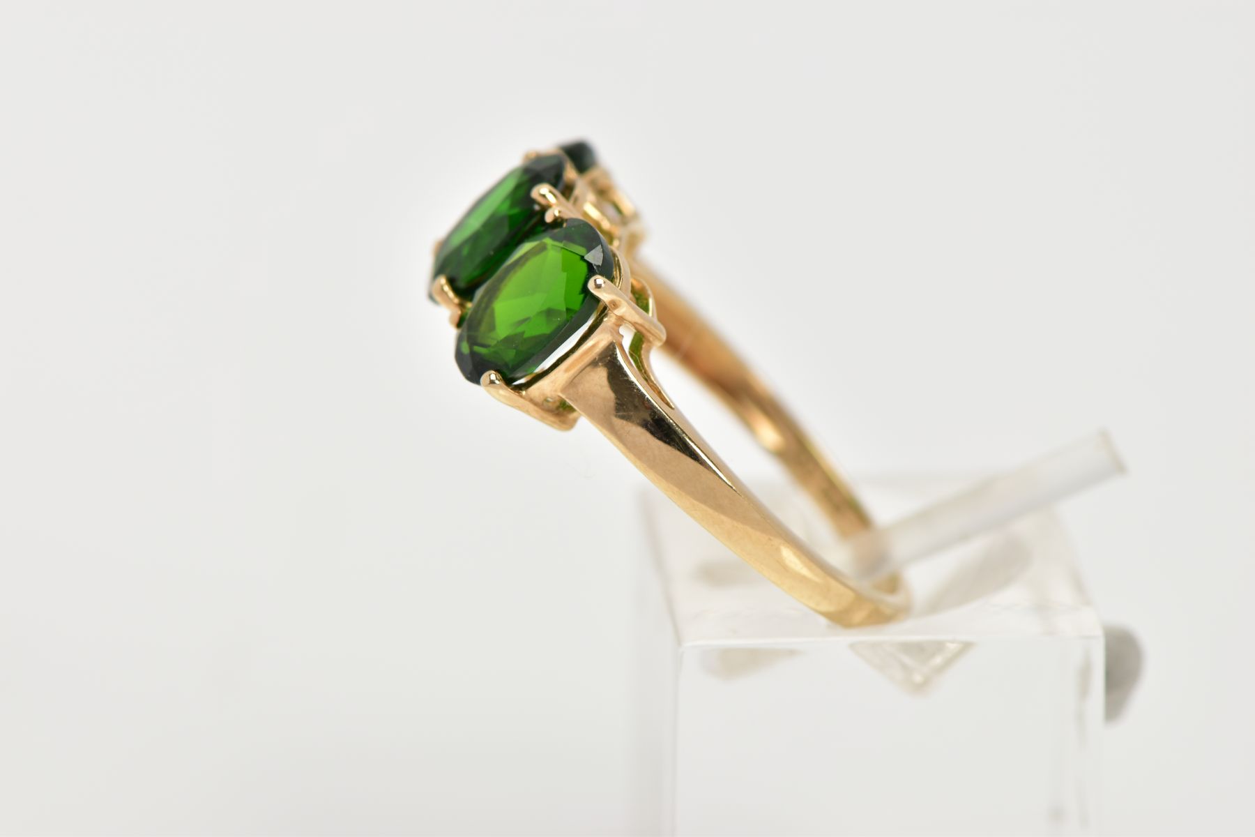 A 9CT GOLD THREE STONE TOURMALINE DRESS RING, designed with three oval cut, green stones assessed as - Image 2 of 4