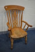 A BEECH WINDSOR ARMCHAIR (Sd) (the item in this lot is the remanence of a fire damaged property)