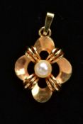 A 9CT GOLD PEARL SET PENDANT, the pendant of an openwork design, set with a single cultured pearl,