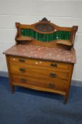 AN EDWARDIAN OAK AND INLAID WASHSTAND/CHEST OF DRAWERS, with a matched tile back and a marble top,