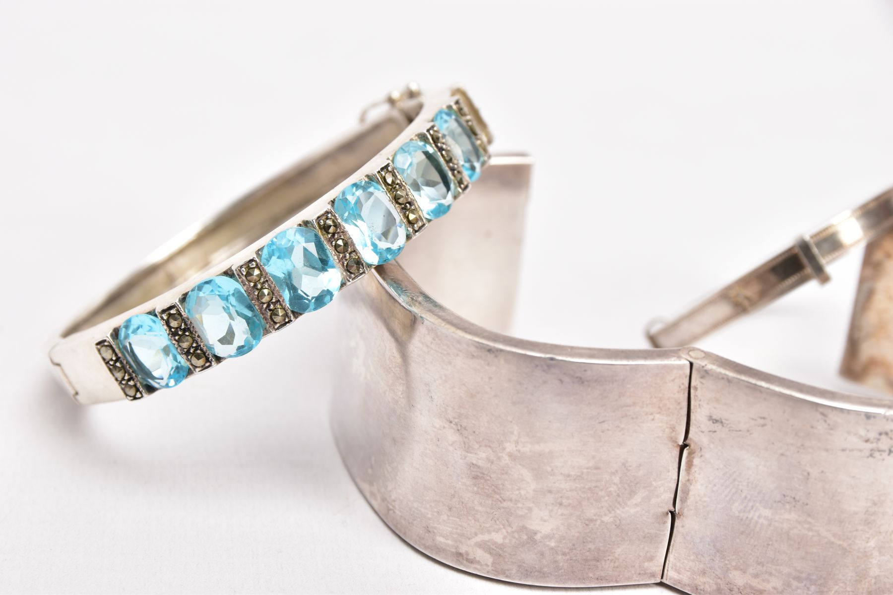 FOUR WHITE METAL BANGLES, the first a plain polished square shaped bangle, fitted with a push pin - Image 3 of 3