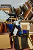 THREE BOXES OF PICTURE FRAMES, including some wall art and a cork memo board, approximately