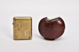 TWO BRASS VESTA CASES, the first a circular nut with hinged arch shape lid and striker panel to