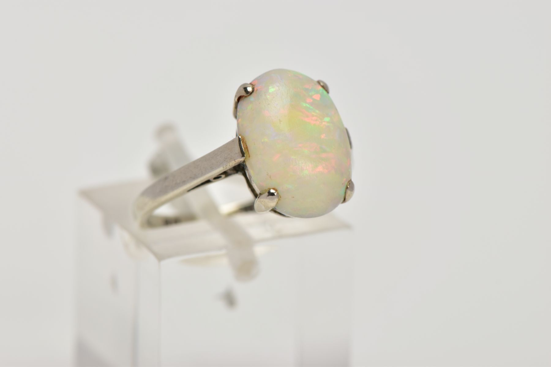 A WHITE METAL OPAL RING, designed with a four-claw set, oval opal cabochon, plain polished shank, - Image 4 of 4