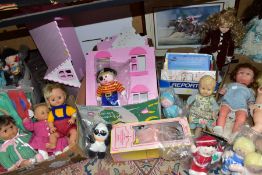 A QUANTITY OF BOXED AND LOOSE DOLLS, KNITTED CLOTHES ETC, including a dolls house to slot