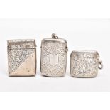 A LATE VICTORIAN SILVER VESTA AND TWO EARLY 20TH CENTURY VESTAS, the Victorian vesta of a rounded