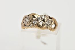 A 9CT GOLD CUBIC ZIRCONIA DRESS RING, of an openwork crossover design, set with circular cut,