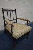 AN EARLY 19TH CENTURY EBONISED BEECH BOBBIN TURNED ARMCHAIR, with open armrests, width 59cm x