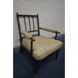 AN EARLY 19TH CENTURY EBONISED BEECH BOBBIN TURNED ARMCHAIR, with open armrests, width 59cm x