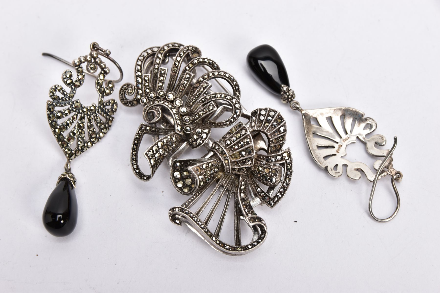 A PAIR OF WHITE METAL MARCASITE AND ONYX EARRINGS, AND A WHITE METAL MARCASITE CLIP BROOCH, the pair - Image 3 of 3
