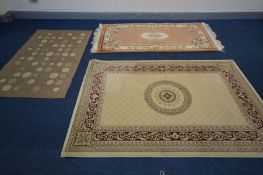 A MODERN RED AND CREAM RUG, 203cm x 134cm, a Chinese russet woollen rug, 194cm x 92cm and another