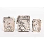 THREE SILVER VESTAS, the first a late Victorian case, of a rectangular form, cut off corners,