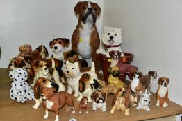 TWENTY SIX CERAMIC AND RESIN DOG FIGURES, to include a Beswick Staffordshire Bull Terrier, model