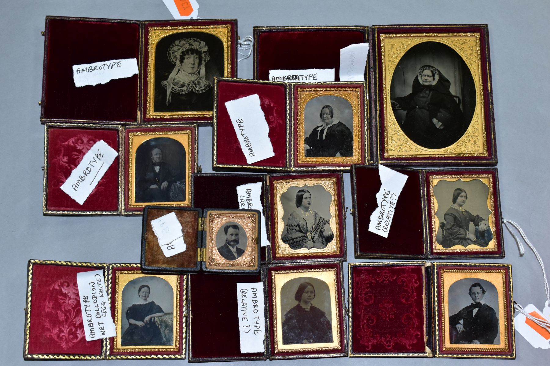 A COLLECTION OF VICTORIAN AMBROTYPES, all in hinged cases with velvet lining and gilt frames, one