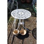 A CAST ALUMINIUM GARDEN TABLE, 60cm diameter with pierced fretwork and three glazed plat pots (4)