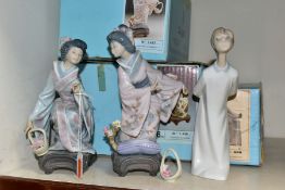 THREE BOXED LLADRO FIGURINES comprising 869 'Boy Blowing', height 20cm, 1448 'Yuki', height 19cm,