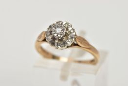 A 9CT GOLD DIAMOND CLUSTER RING, slightly raised cluster, set with a central illusion set single cut