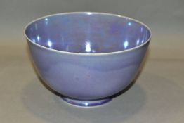 RUSKIN POTTERY, a footed eggshell bowl, covered in a lavender lustre glaze, impressed Ruskin England